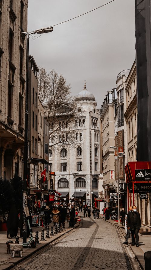 Free Capture the essence of a historic European city with charming cobblestone streets and classic architecture. Stock Photo