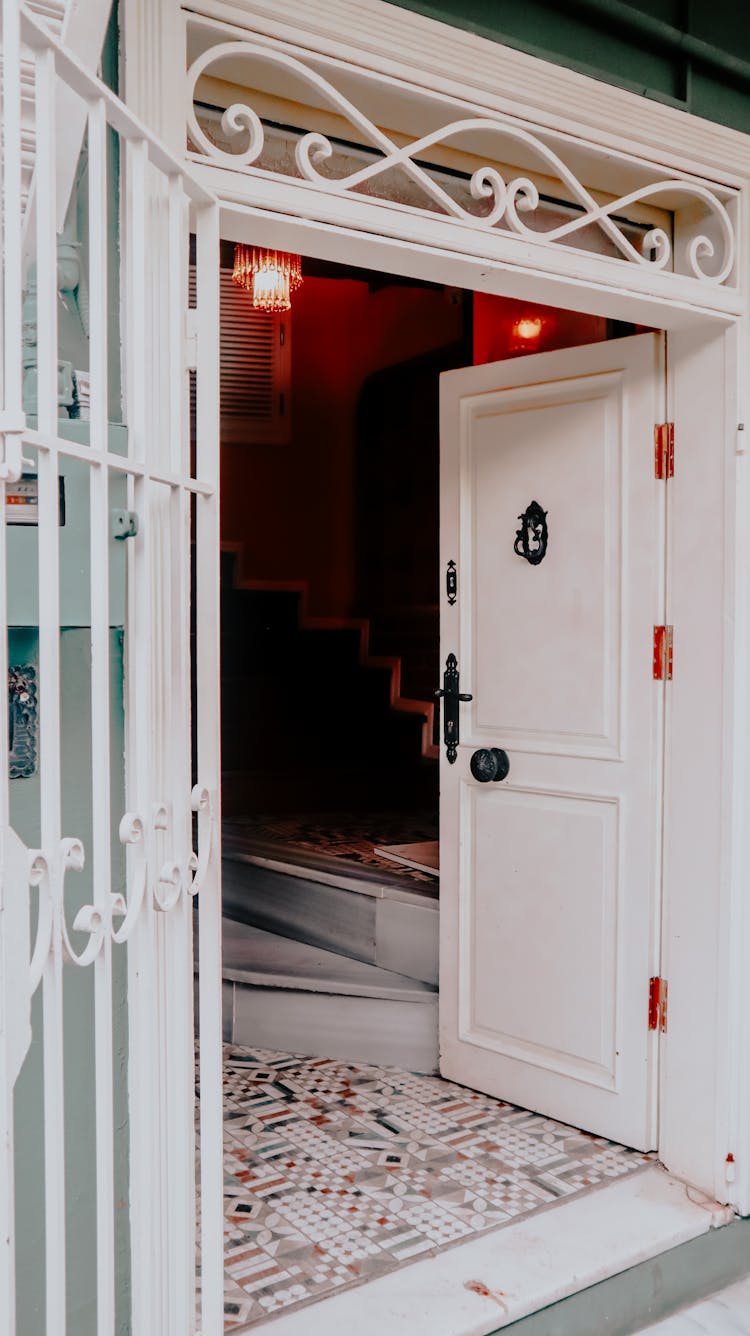 White Entrance Doors To Dimly Lit House