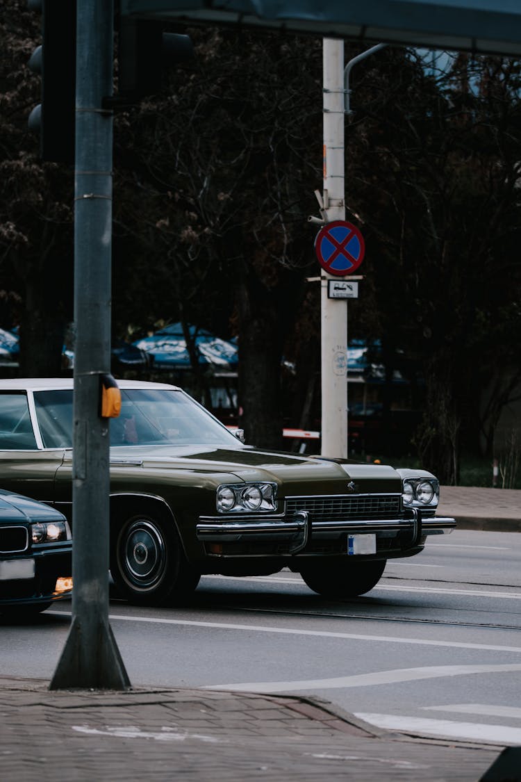 Vintage Car Stopping At Intersection