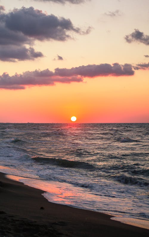 Sunset sky over waving sea