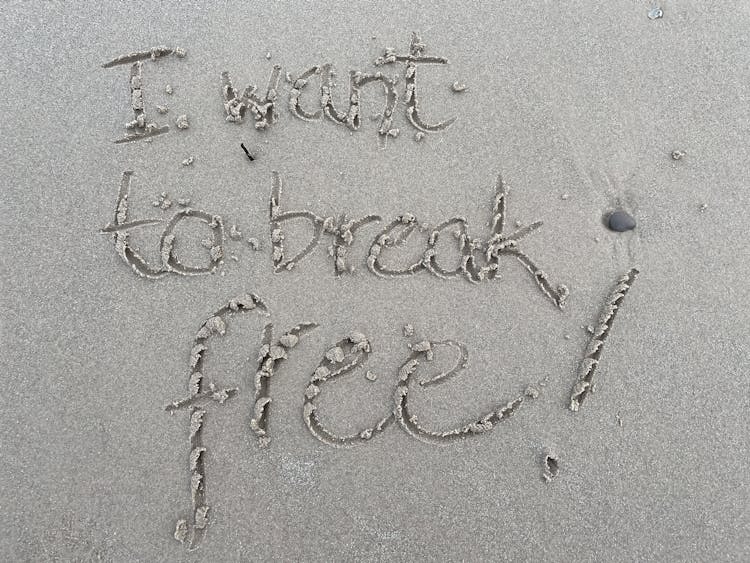 I Want To Break Free Written In The Sand