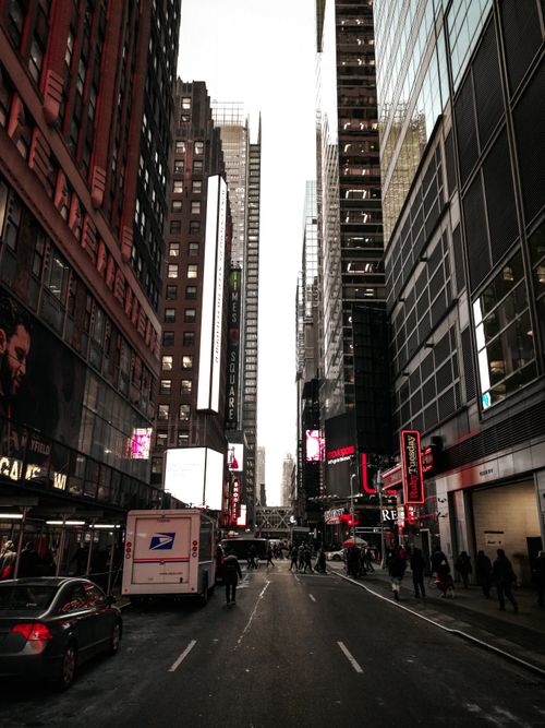 Free Urban street scene in Times Square with towering skyscrapers and bustling traffic. Stock Photo