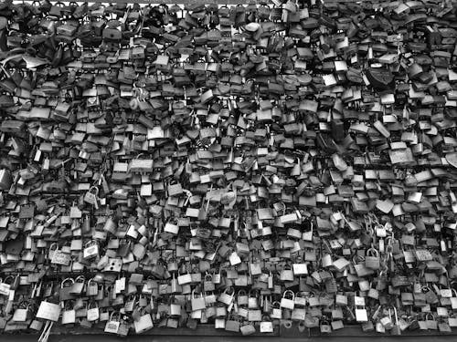 Grayscale Photo of Padlocks