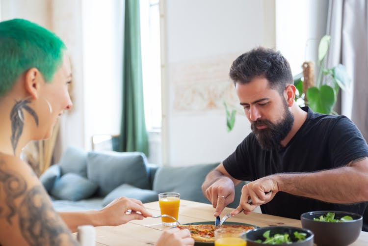 Two People Eating At Home