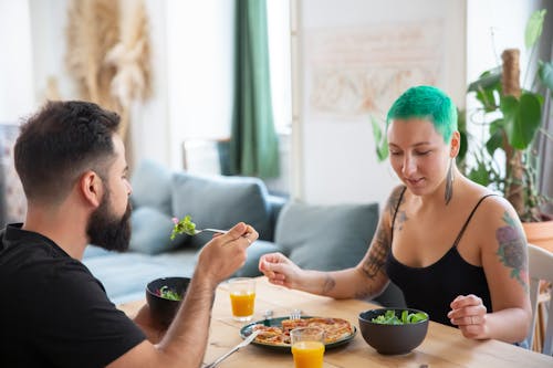 Free A Couple Eating Together Stock Photo