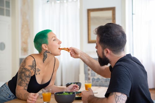 Free A Woman Eating Pizza Stock Photo