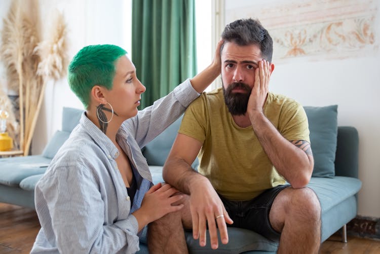 Woman Comforting Stressed Man