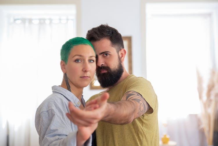 A Couple Dancing At Home