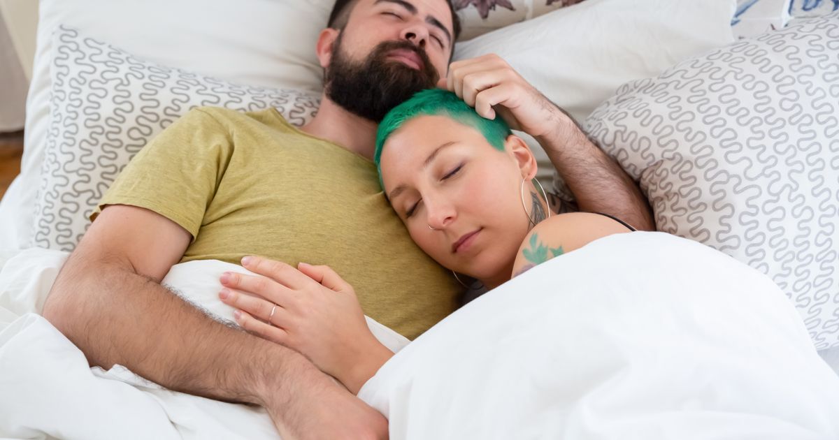 Couple sleeping and bedroom comfort — Ideal Sleep Temperature for a Good Night's Rest