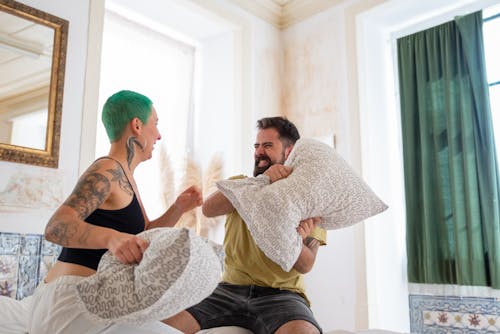 Man and a Woman Having a Pillow Fight