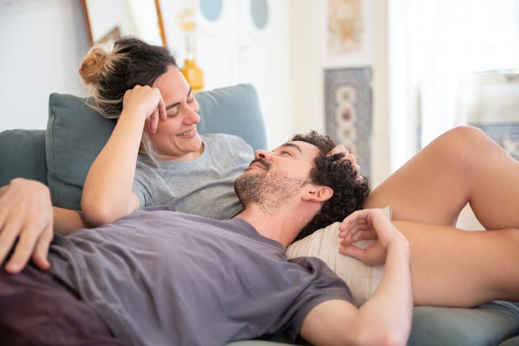 Romantic Couple Lying On Sofa