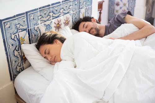 Free Couple Sleeping on the Bed Stock Photo