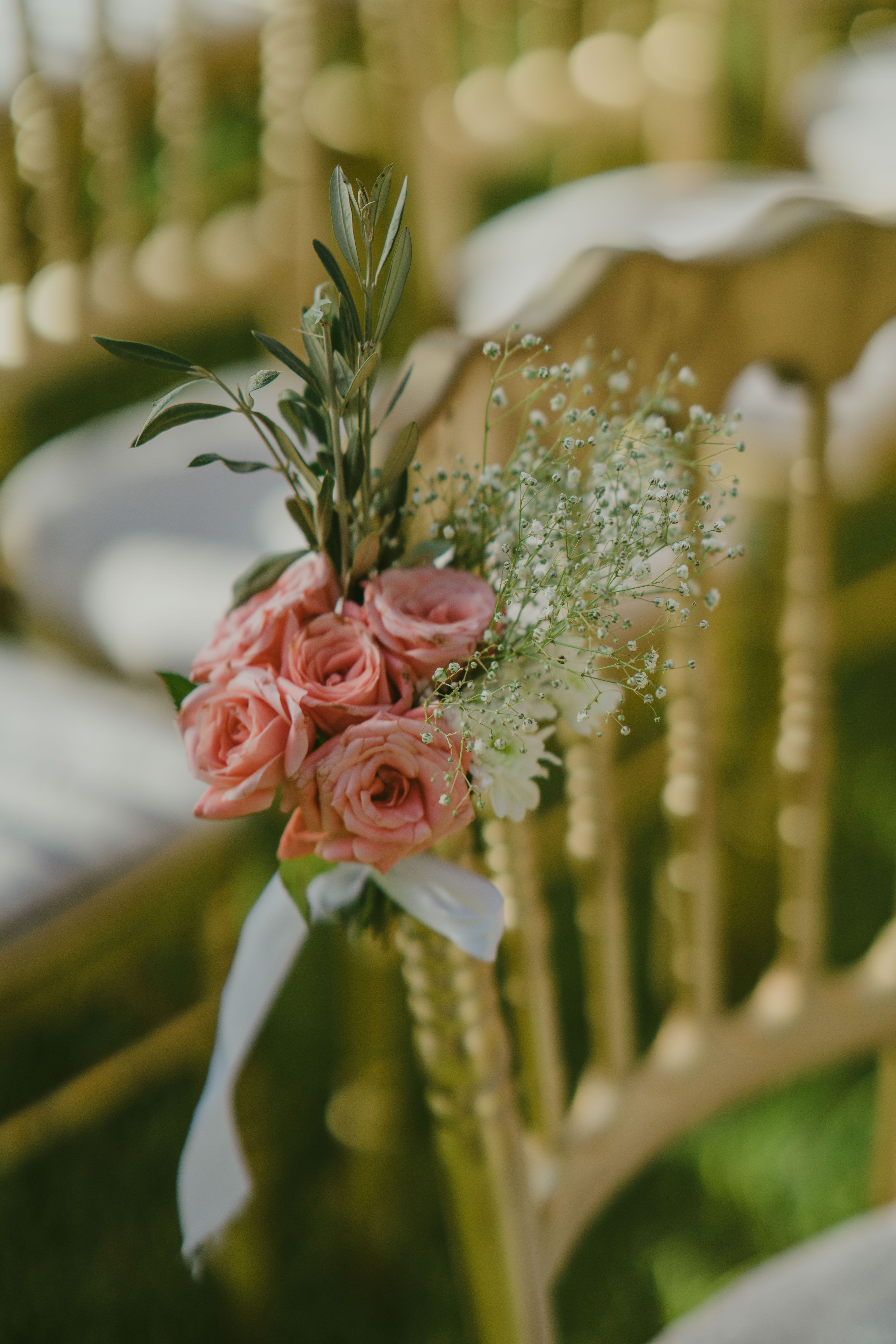 Chair Decorated with Small Bouquet of Pink Roses · Free Stock Photo