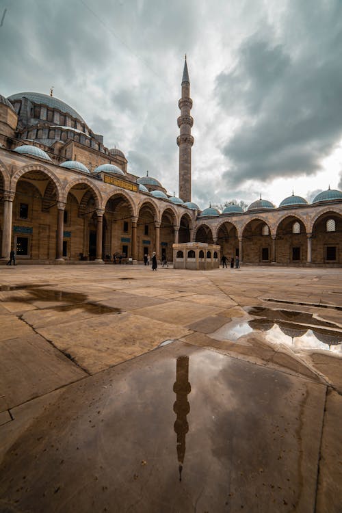 Minaret Reflecting in a Rain Pool at Suleymaniye Mosque Courtyard, Istanbul, Turkey