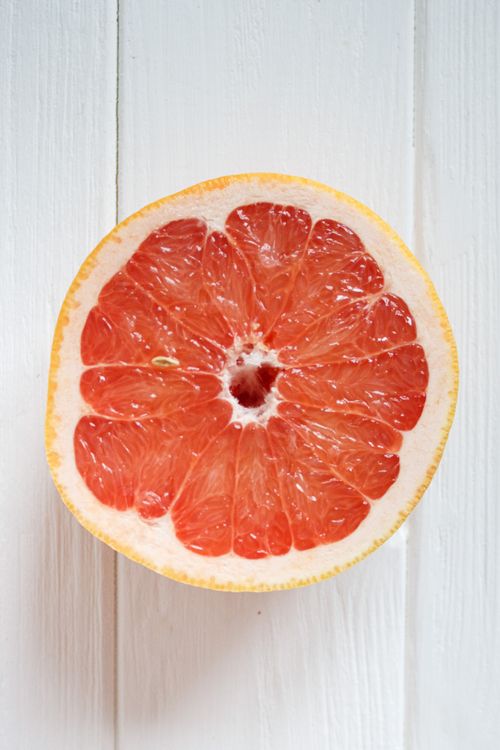 Freshly sliced pink grapefruit half
