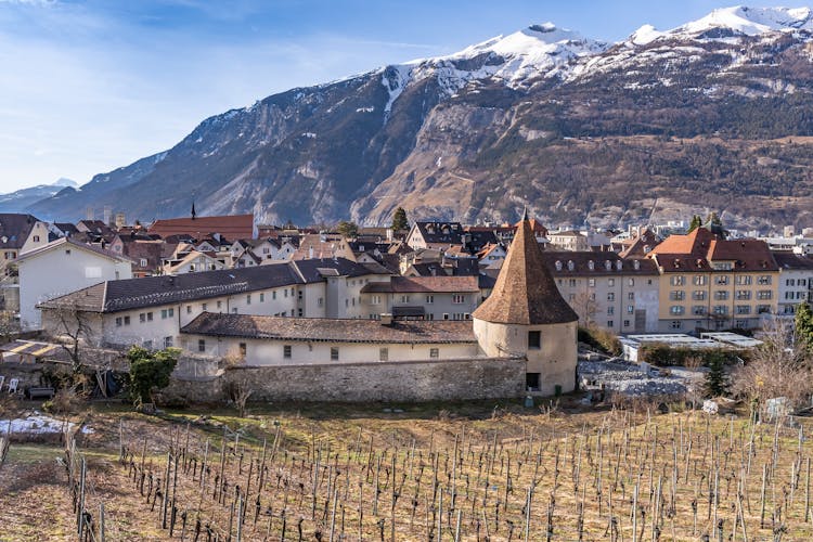 Castle Of Medieval Swiss Town Chur Beside Mountains