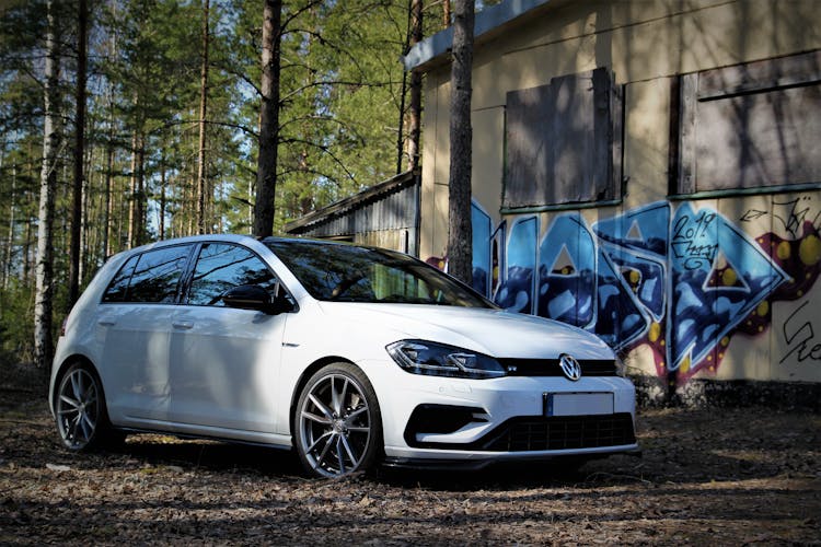 White BMW Wagon Parked Near Woods