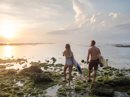 Man and Woman Standing on Rocks