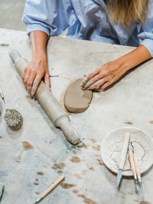 Person Holding Wooden Rolling Pin