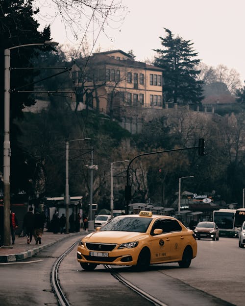 Yellow Taxi on City Street