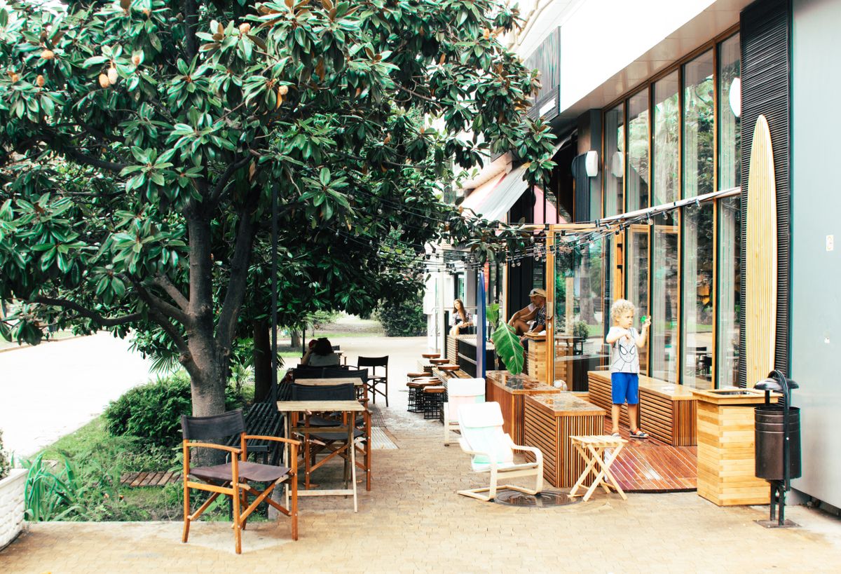 Child in front of a garden cafe