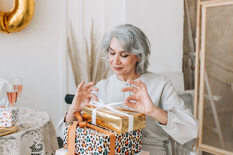 Woman Opening A Gift