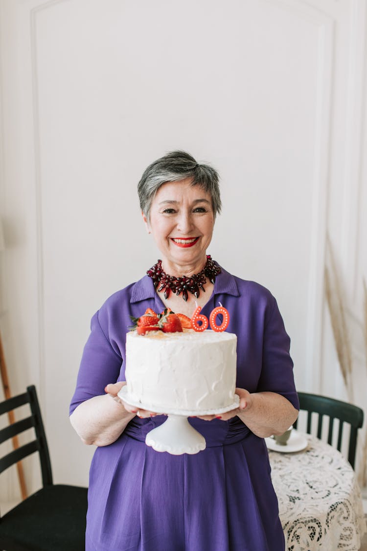 Woman Holding A Cake