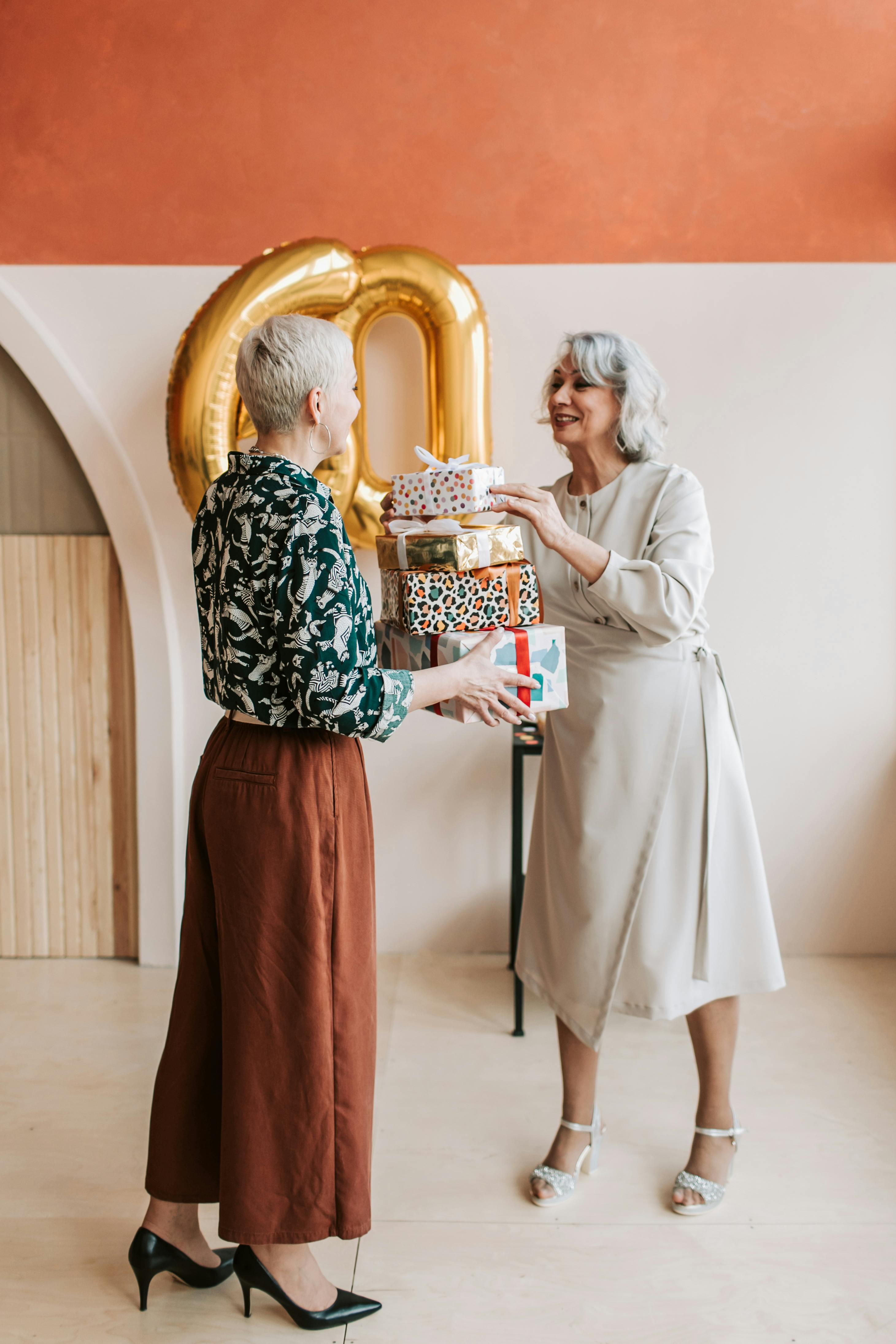 happy elderly woman giving gifts