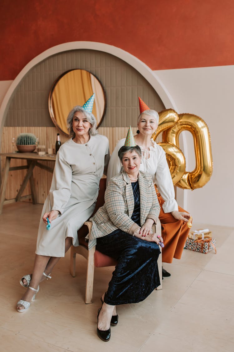 A Group Of Elderly Women Sitting Together