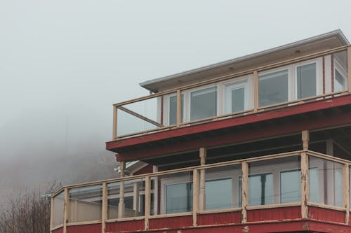 Shabby house against foggy sky