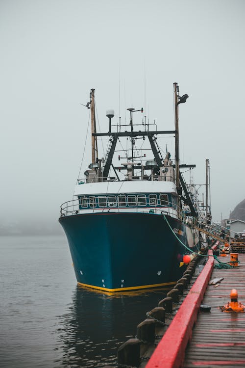 Ship moored on pier in sea