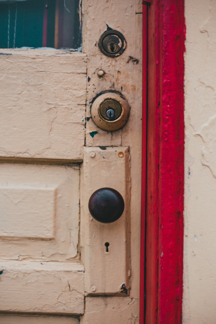 Aged Yellow Door With Red Cant