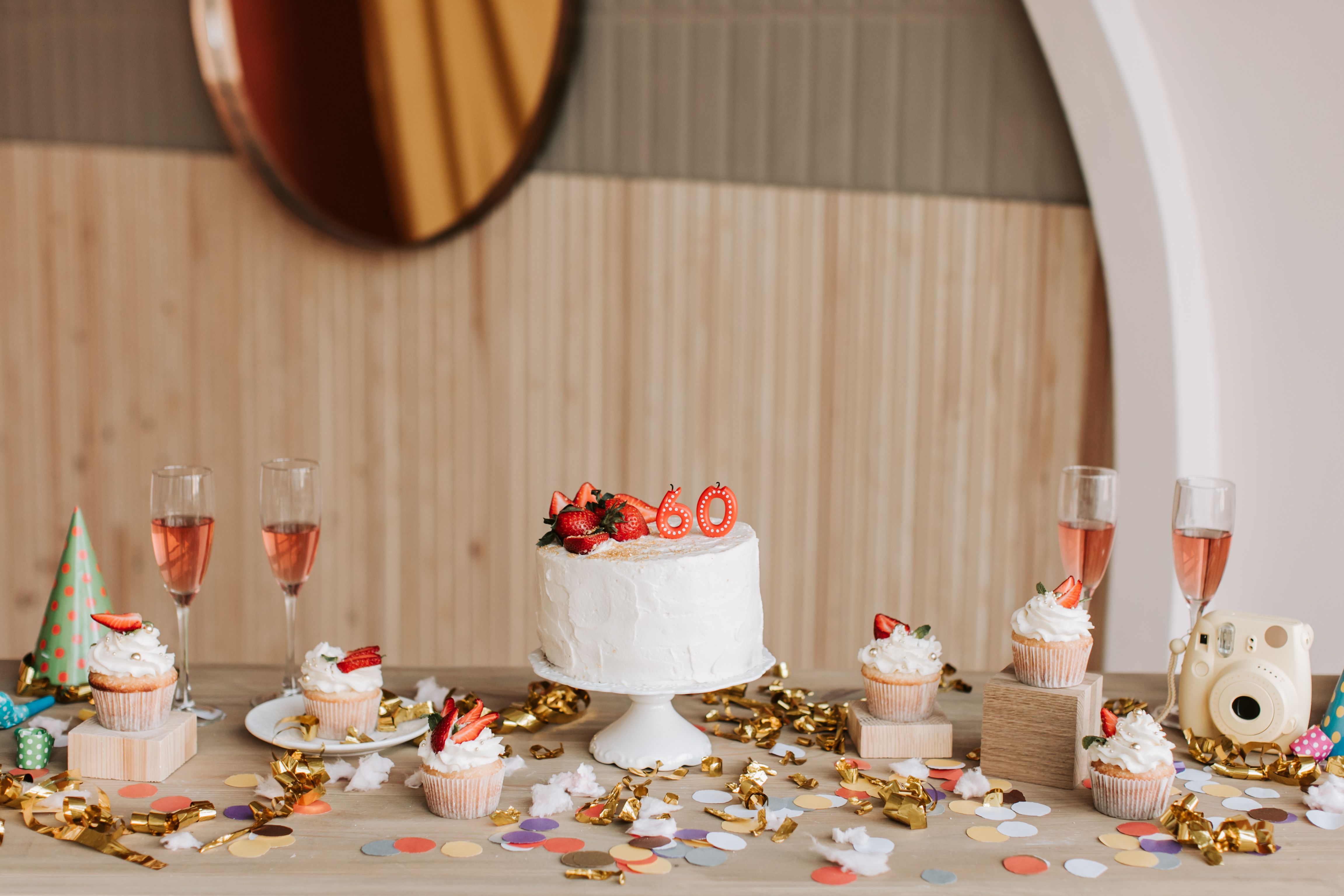 Birthday cake served with complimentary cupcakes