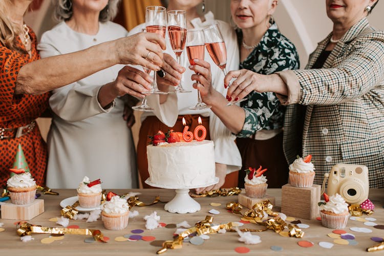 A Group Of Elderly Women Doing A Toast