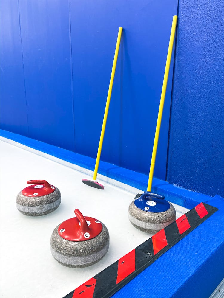 Curling Stones And Brooms