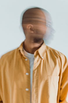 A conceptual portrait with a blurred motion effect, creating an artistic impression.