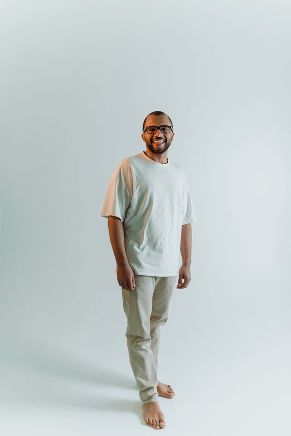 Model in a soft mint tee and matching trousers — photo by VAZHNIK on Pexels