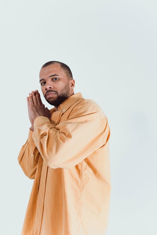 A Man in Orange Button Up Long Sleeves