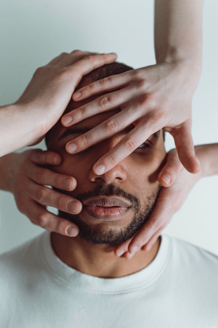 Photo Of Hands Covering A Man's Face