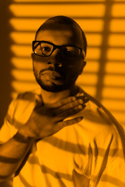 Close Up Photo of Bearded Man Wearing Eyeglasses