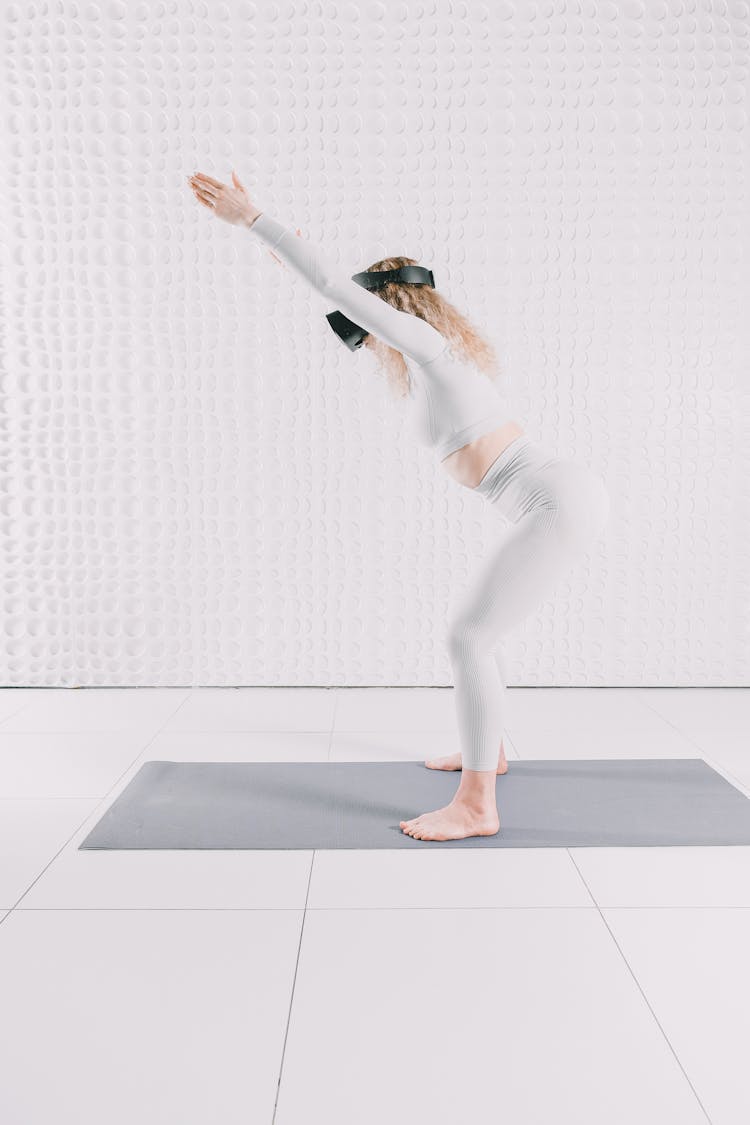 Woman Practicing With VR Goggles