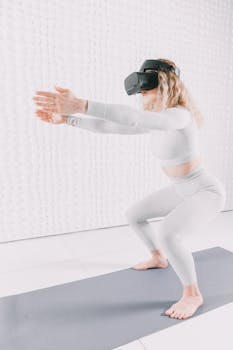 Woman in white practicing yoga with VR headset in minimalist room.