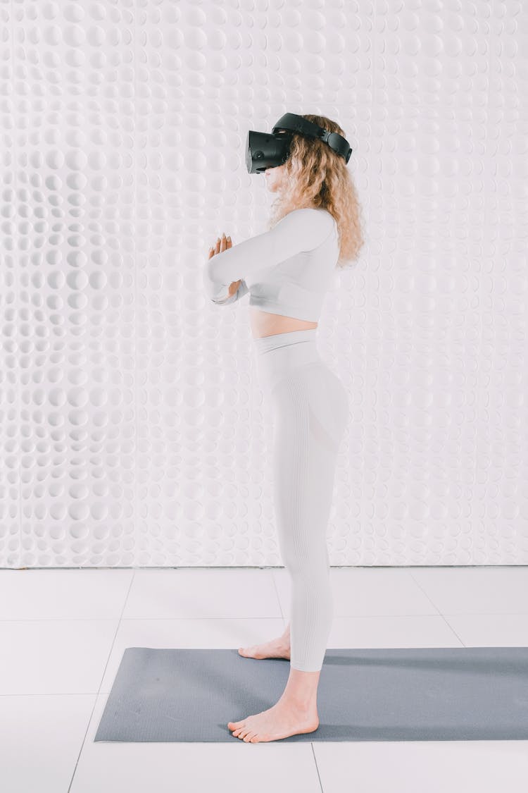 Woman Standing On Mat With VR Goggles