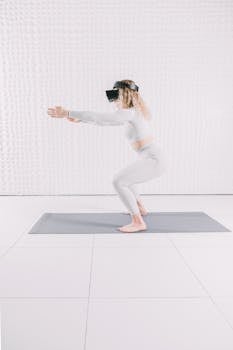Woman practicing exercises with virtual reality headset indoors.