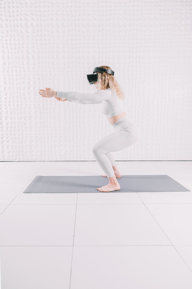 Woman On Mat With VR Goggles