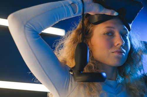 Woman Putting on a Virtual Reality Headset 