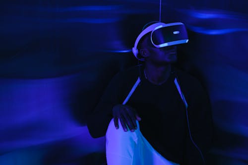 Man Playing on a Game with VR Headset