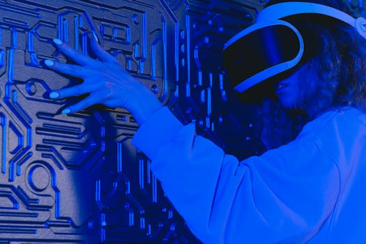 A woman wearing a VR headset touches a textured wall in a blue-lit futuristic environment.