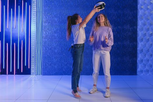 2 Women Standing on White Floor Tiles