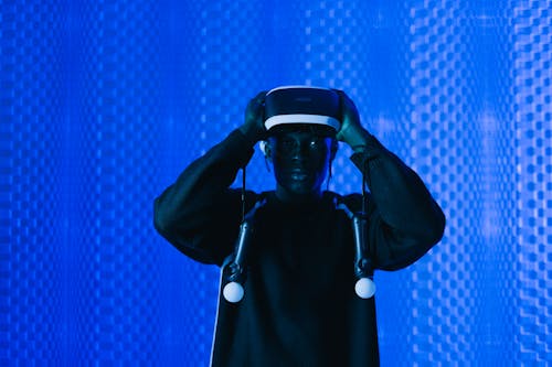 Man with Virtual Reality Headset and Controllers